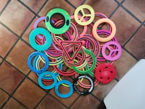 Photo of over 30 flying rings to show their range of colours and styles