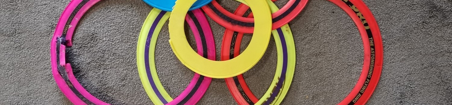 Photo of colourful flying rings on a carpet