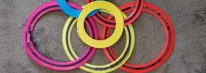 Photo of colourful flying rings on a carpet