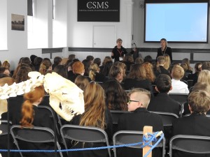 Photo showing large groups of secondary pups listening to a talk. about our future